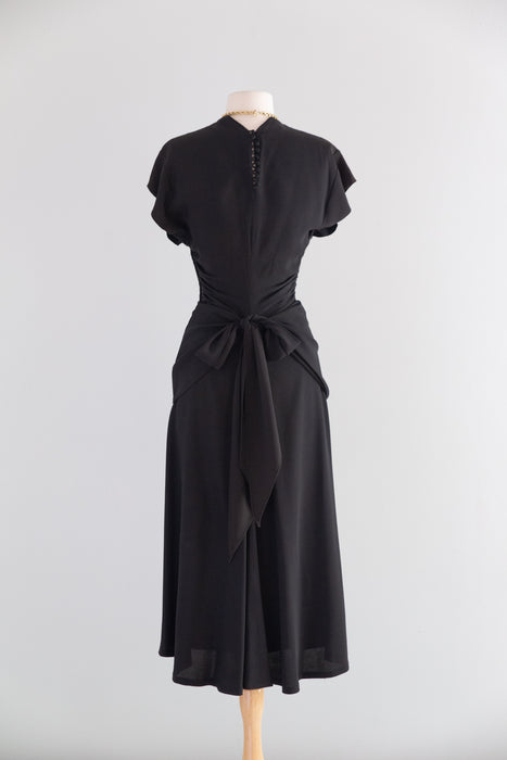 Elegant 1940's Black Rayon Cocktail Dress With Tie Back Peplum / SM