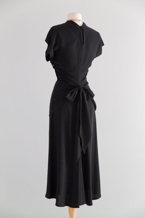 Elegant 1940's Black Rayon Cocktail Dress With Tie Back Peplum / SM
