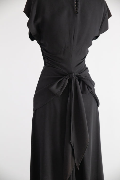 Elegant 1940's Black Rayon Cocktail Dress With Tie Back Peplum / SM