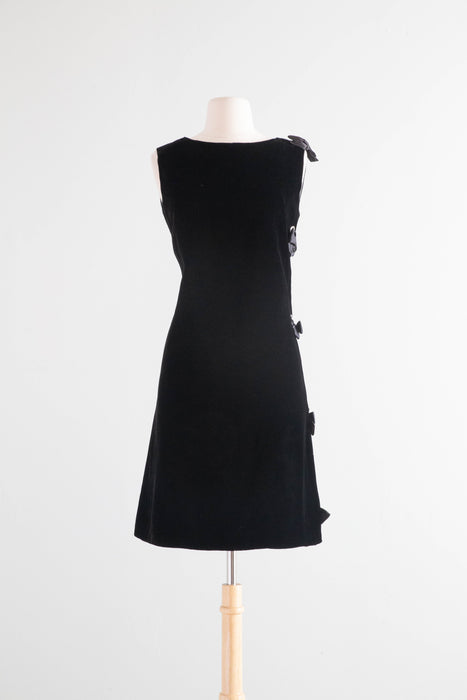 Fabulous 1960's Black Velvet Shift Dress With Rhinestone Grommet Sides and Bows / Medium