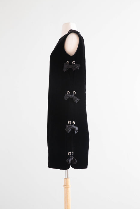 Fabulous 1960's Black Velvet Shift Dress With Rhinestone Grommet Sides and Bows / Medium