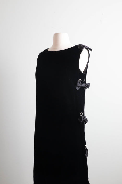 Fabulous 1960's Black Velvet Shift Dress With Rhinestone Grommet Sides and Bows / Medium