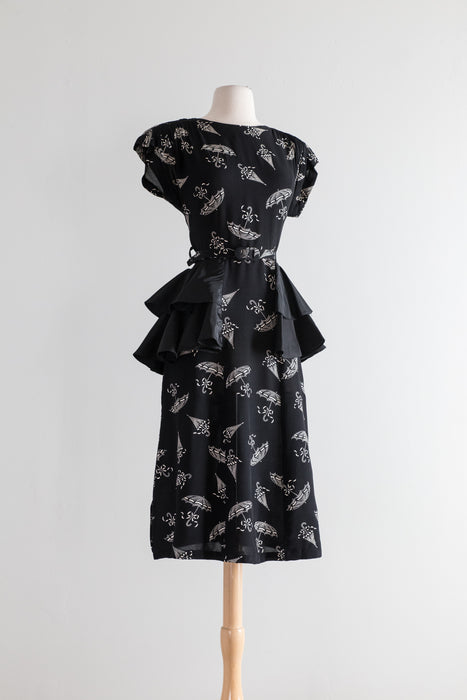 1940's Umbrella Print Black Rayon Cocktail Dress With Taffeta Peplum / Waist 27"